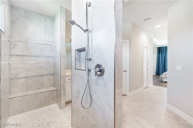 bathroom with tiled shower