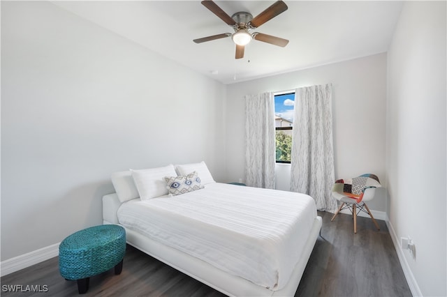 bedroom featuring dark hardwood / wood-style floors and ceiling fan