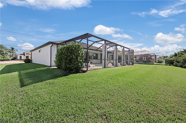 view of yard featuring glass enclosure