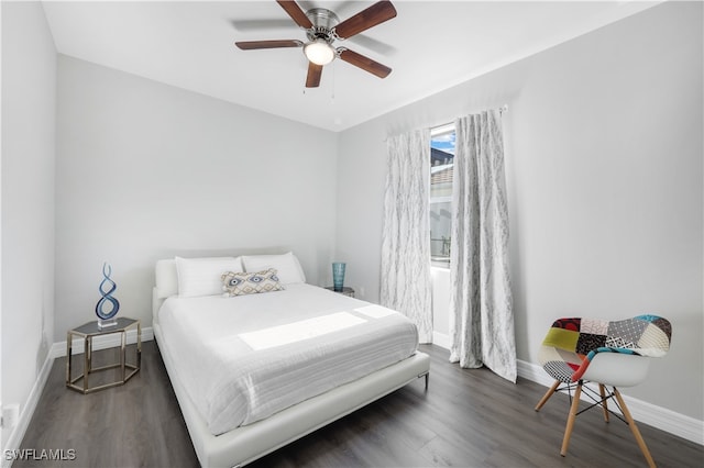 bedroom featuring ceiling fan and dark hardwood / wood-style flooring