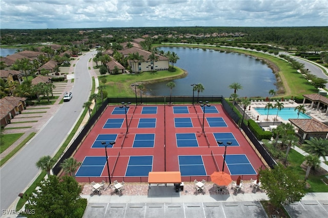 birds eye view of property with a water view