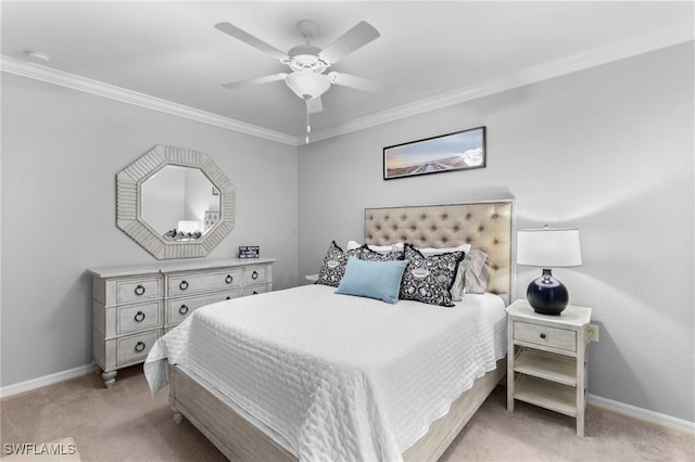 carpeted bedroom with ornamental molding and ceiling fan