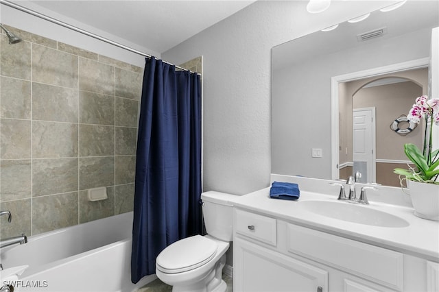 full bathroom with toilet, vanity, and shower / bathtub combination with curtain