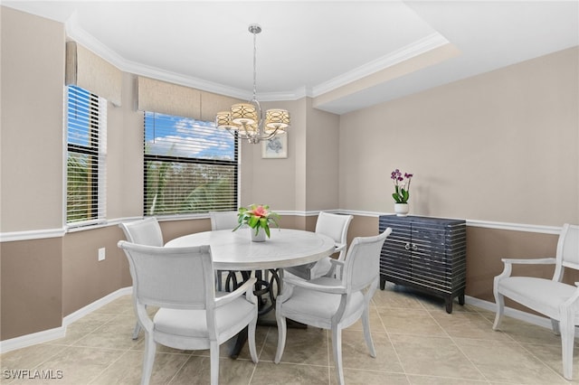 dining space with ornamental molding, light tile patterned floors, and an inviting chandelier