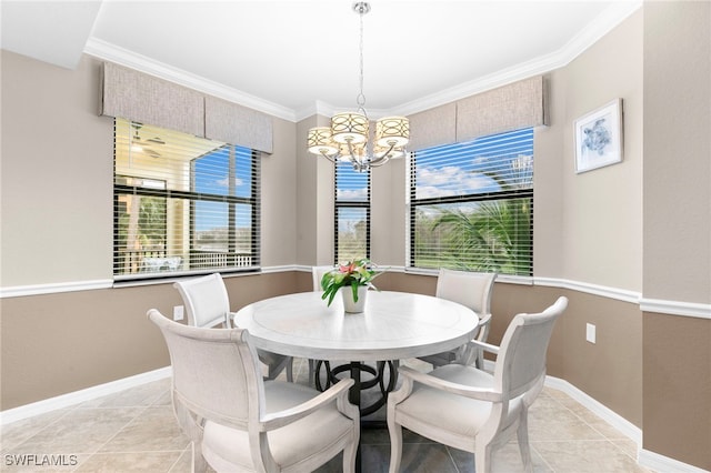 tiled dining room featuring a chandelier and ornamental molding