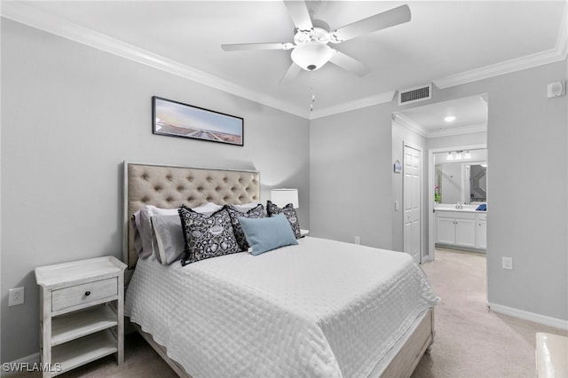 carpeted bedroom featuring connected bathroom, ceiling fan, and crown molding