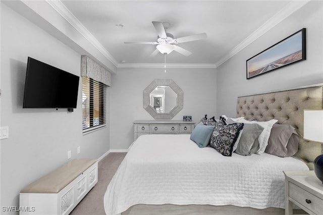 carpeted bedroom with ceiling fan and ornamental molding