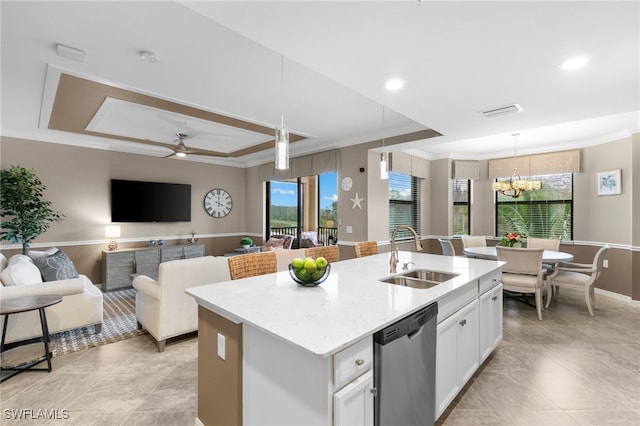 kitchen with dishwasher, white cabinets, sink, an island with sink, and pendant lighting