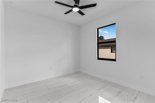 spare room featuring ceiling fan