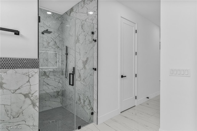 bathroom with a shower with shower door