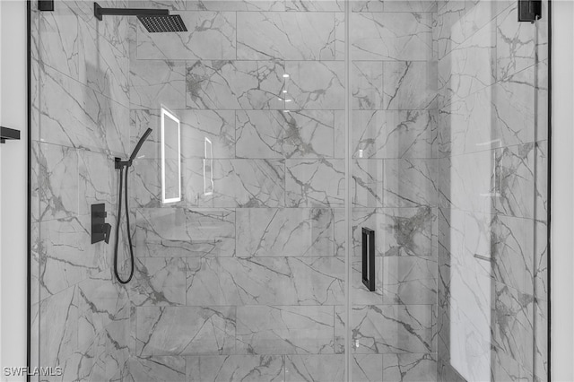 interior details featuring an enclosed shower