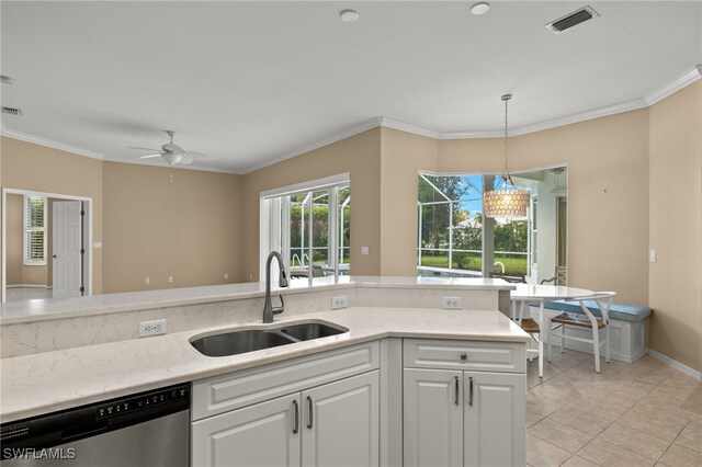 kitchen with white cabinetry, sink, ceiling fan, stainless steel dishwasher, and crown molding