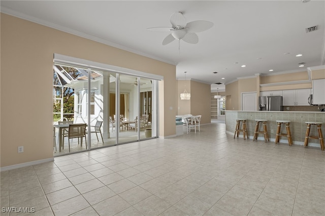 living room featuring recessed lighting, light tile patterned floors, crown molding, visible vents, and baseboards