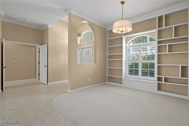 unfurnished room featuring an inviting chandelier, built in features, tile patterned floors, baseboards, and ornamental molding