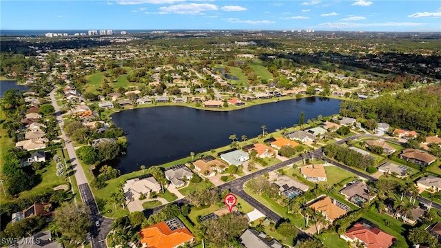 bird's eye view featuring a residential view and a water view
