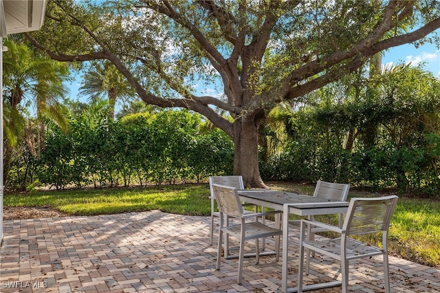 view of patio featuring outdoor dining area