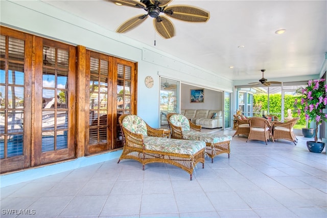 sunroom with ceiling fan