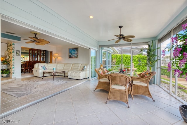 sunroom / solarium with ceiling fan