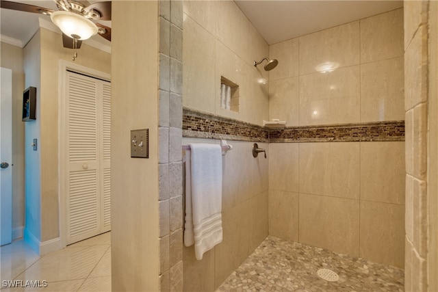 bathroom featuring tile patterned floors, ceiling fan, and a tile shower