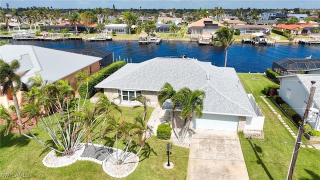 birds eye view of property with a water view