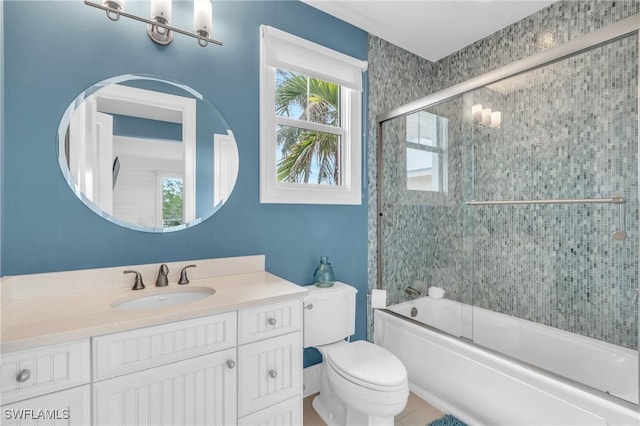 full bath featuring shower / bath combination with glass door, vanity, and toilet