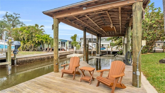 dock area with a water view and boat lift