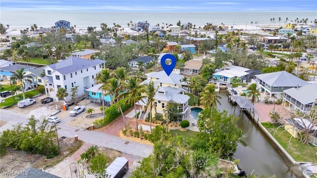 drone / aerial view featuring a water view and a residential view