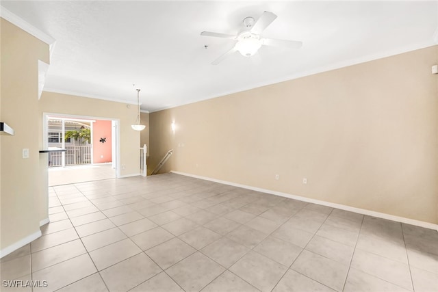 empty room with light tile patterned flooring, crown molding, and ceiling fan