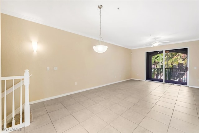 tiled spare room featuring ceiling fan and crown molding