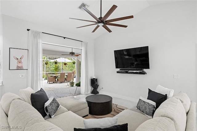 living room featuring ceiling fan and vaulted ceiling