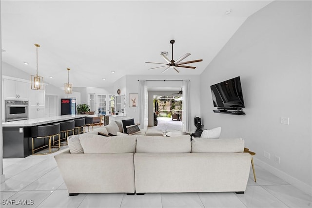 tiled living room featuring high vaulted ceiling and ceiling fan