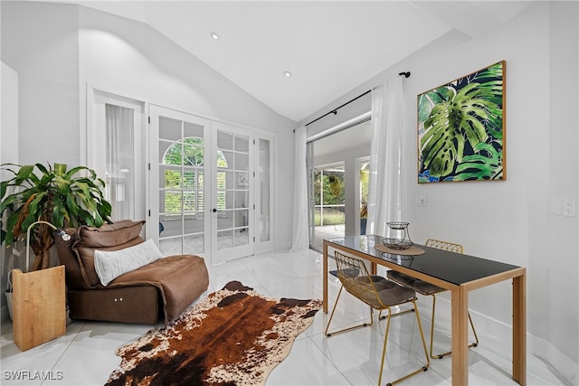 office featuring french doors, vaulted ceiling, and light tile patterned floors