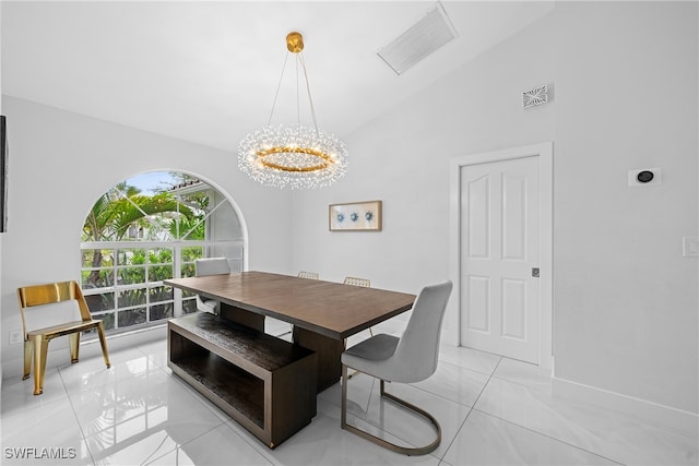 tiled dining space featuring high vaulted ceiling and a notable chandelier