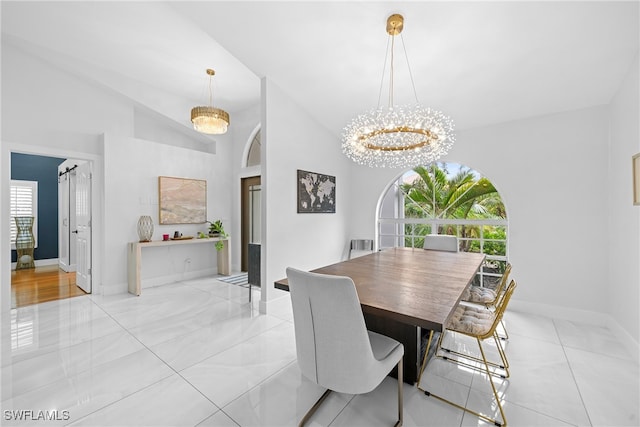 dining area featuring a healthy amount of sunlight, vaulted ceiling, light tile patterned flooring, and a notable chandelier