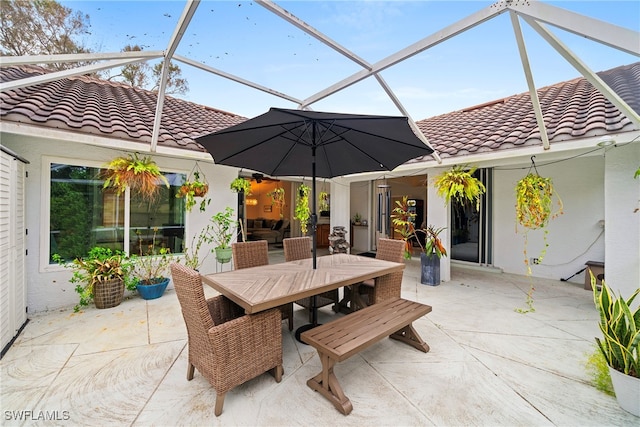 view of patio / terrace with glass enclosure