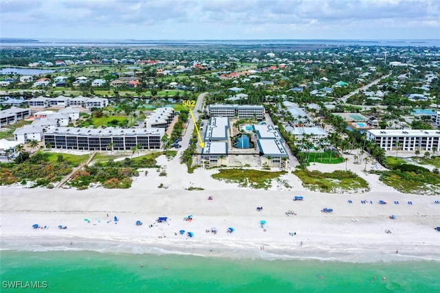 bird's eye view with a view of the beach and a water view