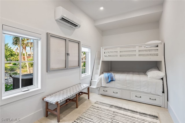 bedroom featuring multiple windows and a wall unit AC