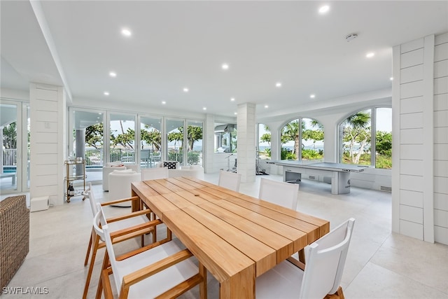 dining room featuring decorative columns