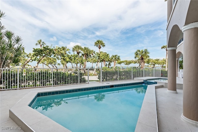 view of swimming pool with a patio area