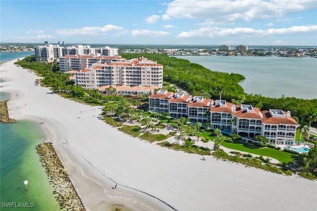 drone / aerial view featuring a view of the beach and a water view