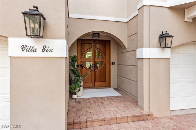 property entrance with a garage