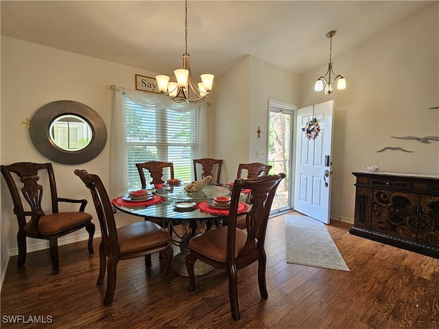 dining room featuring a chandelier and dark hardwood / wood-style floors