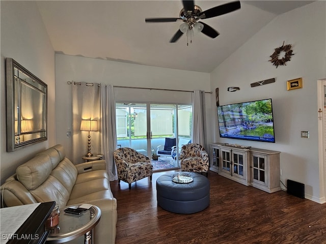 living room with dark wood-type flooring, ceiling fan, and vaulted ceiling