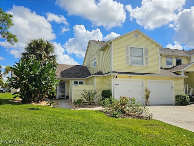 view of front facade with a garage and a front yard