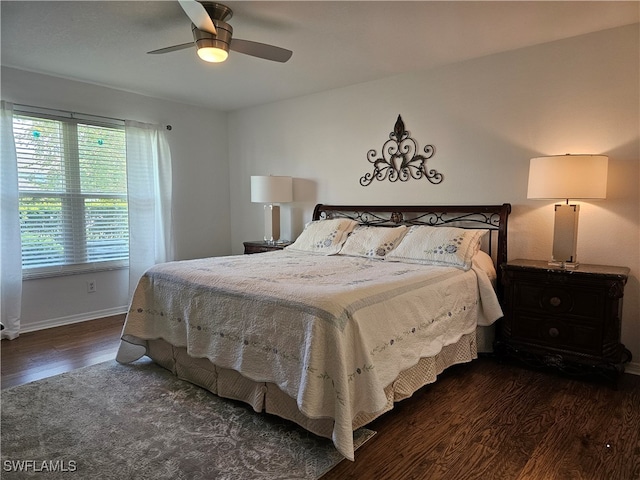 bedroom featuring dark hardwood / wood-style flooring and ceiling fan