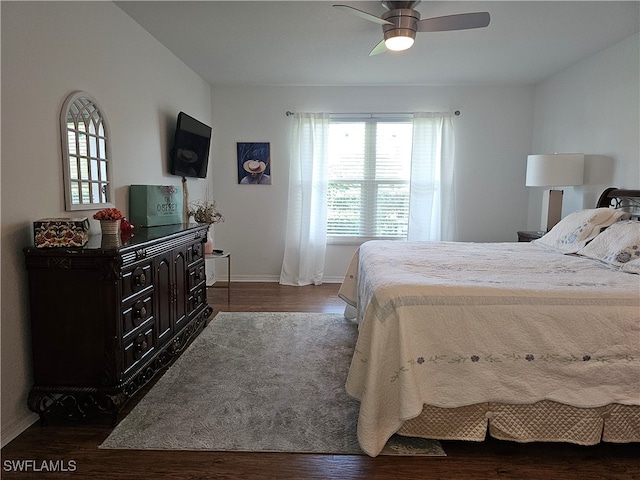 bedroom featuring dark hardwood / wood-style floors and ceiling fan