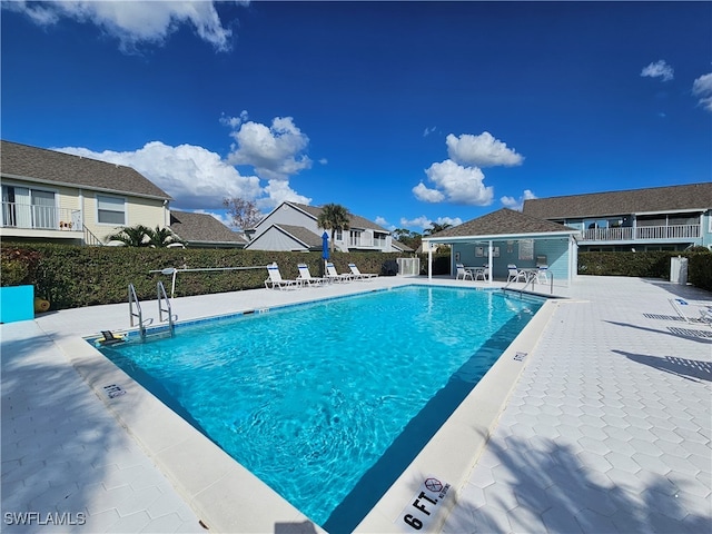 view of swimming pool with a patio area