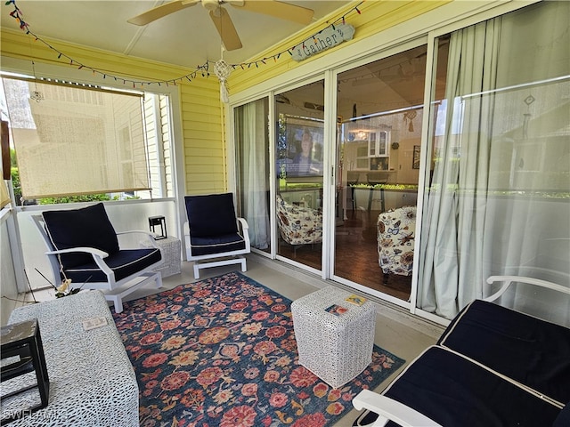 sunroom / solarium with ceiling fan