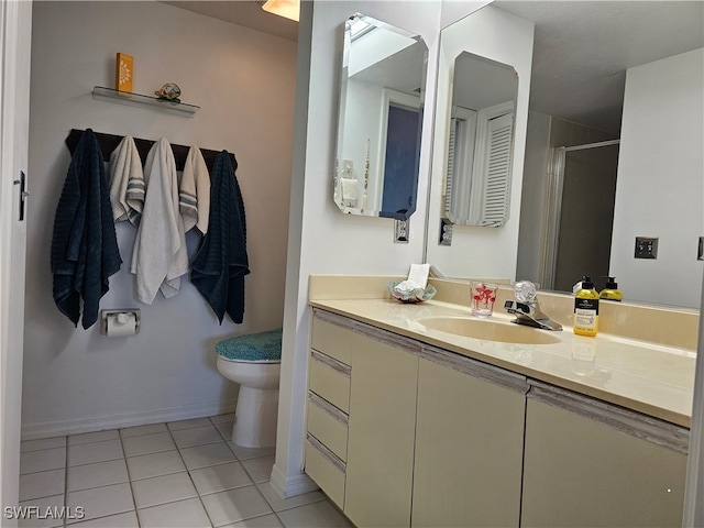 bathroom featuring walk in shower, tile patterned flooring, vanity, and toilet