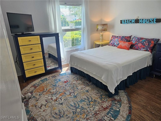 bedroom featuring wood finished floors